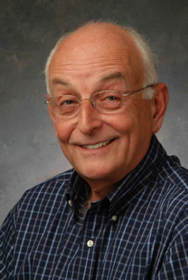 Senior man with glasses smiling