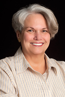 Senior woman in collared shirt