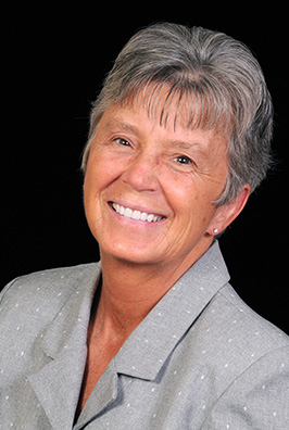 Smiling woman with grey hair