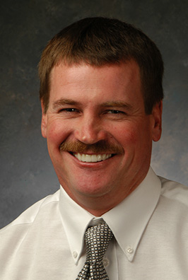 Man with mustache and tie