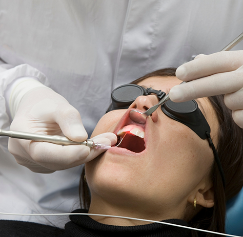 Female patient receiving treatment with soft tissue laser