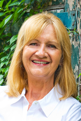 Blonde patient with white collared shirt