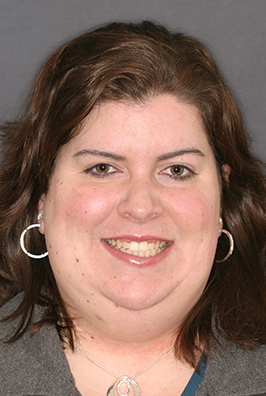 Smiling woman with hoop earrings