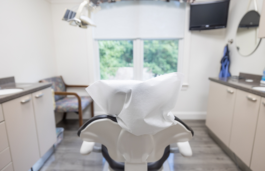 Back of dental chair in front of window