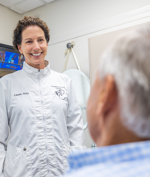 Concord dental team member Laurie greeting patient